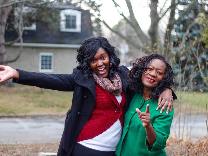 Photo of two happy African American women hugging